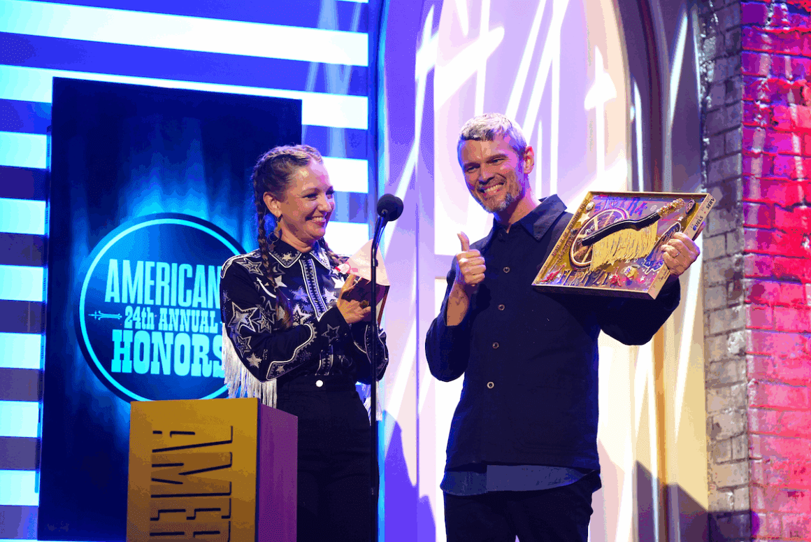Kelsey Waldon and Luther Dickinson accept the Artist of the Year Award on behalf of Sierra Ferrell onstage for the 24th Annual Americana Honors & Awards at Ryman Auditorium on Sept. 10, 2025 in Nashville, Tenn. (Photo by Erika Goldring/Getty Images)